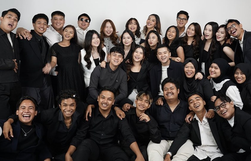 The MANNA team in black outfits, posing together in a studio